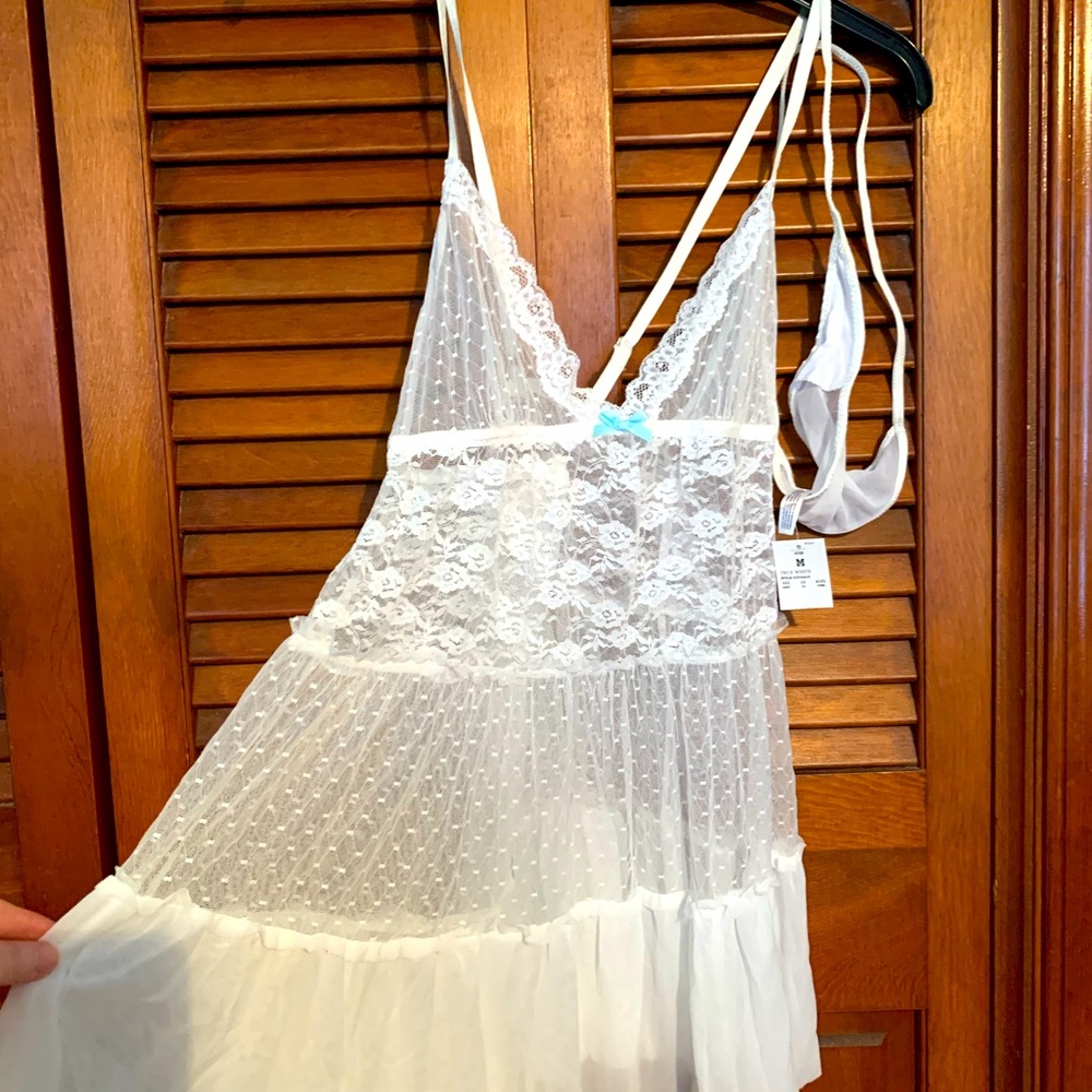 White lace lingerie with thong panty. Size Medium. New With Tags